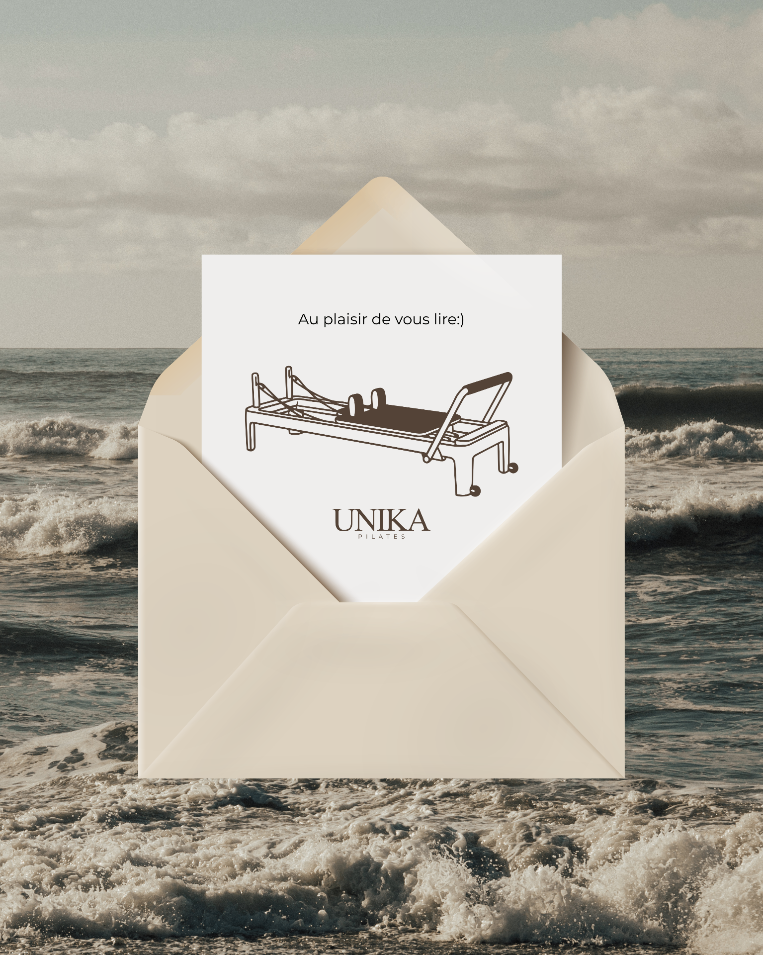 Open UNIKA Pilates envelope with a note 'Looking forward to hearing from you' and a reformer illustration, on an ocean background — invitation to get in touch